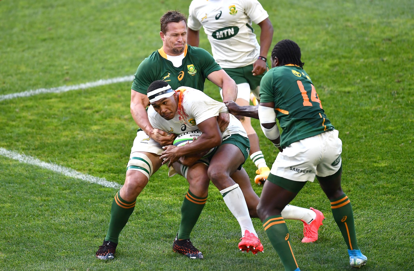 Arno Botha, with support from Yaw Penxe, gets hold of Damian Willemse.