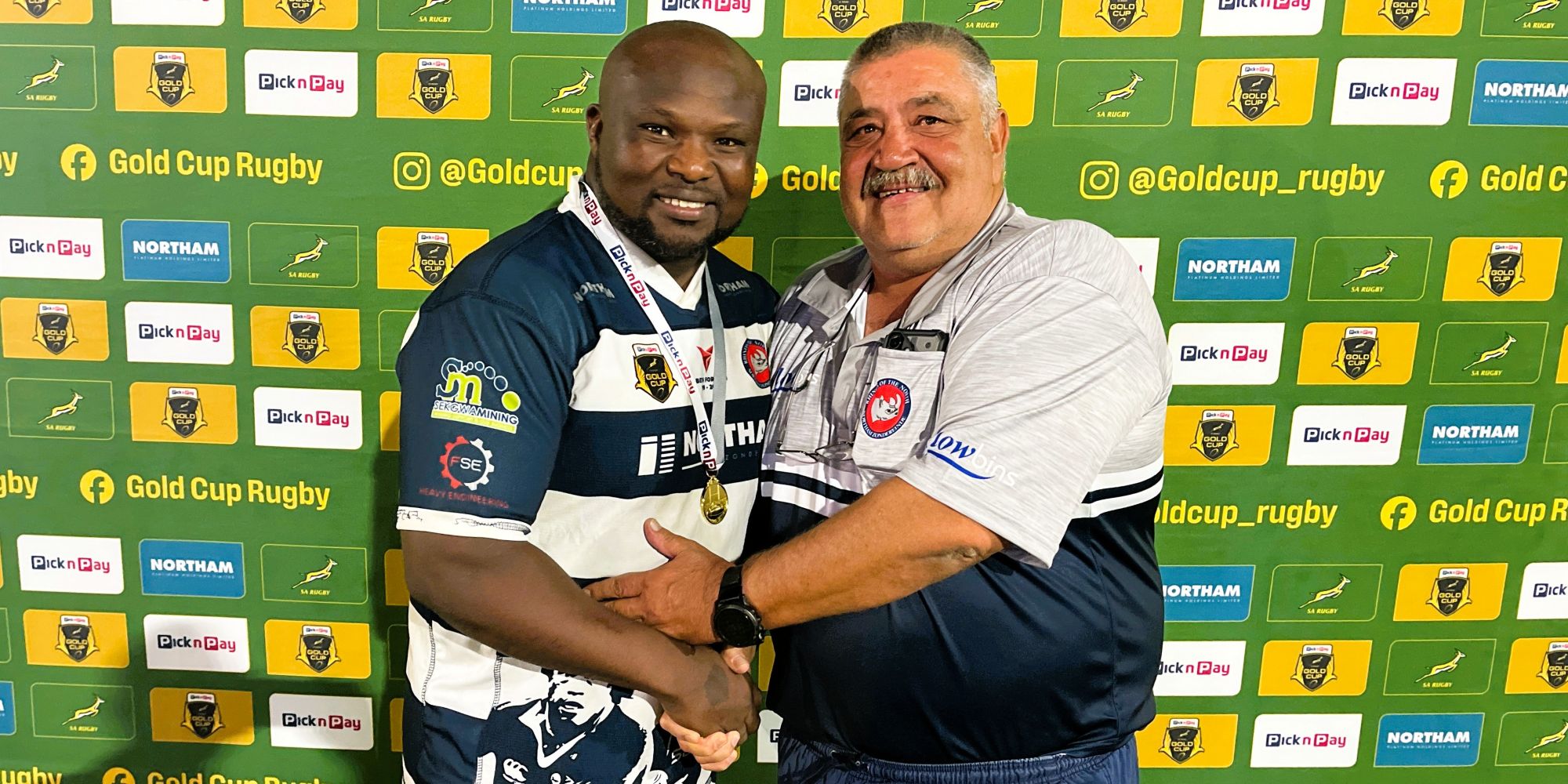 Danny Gonsalves of Pick n Pay Gold Cup sponsors Northam Platinum hands over the Man of the Match award to Khwezi Mkhafu of Rhinos.