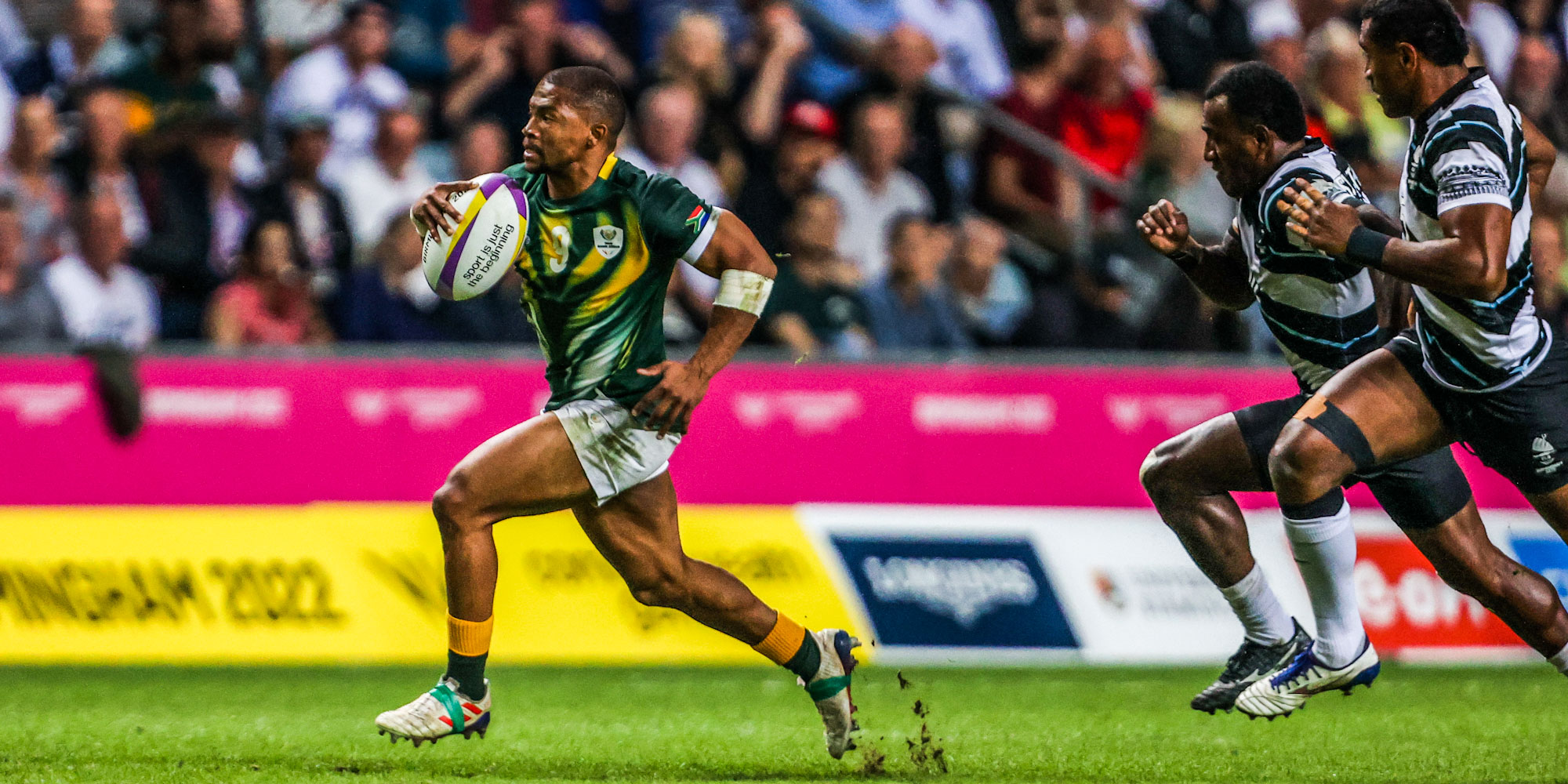 Catch me if you can: Shaun Williams outstrips the Fijian defence.