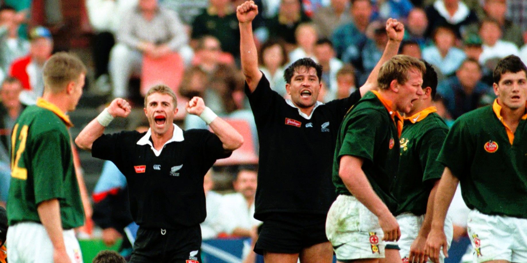 Justin Marshall and Zinzan Brooke celebrate winning the second Test in Pretoria in 1996.